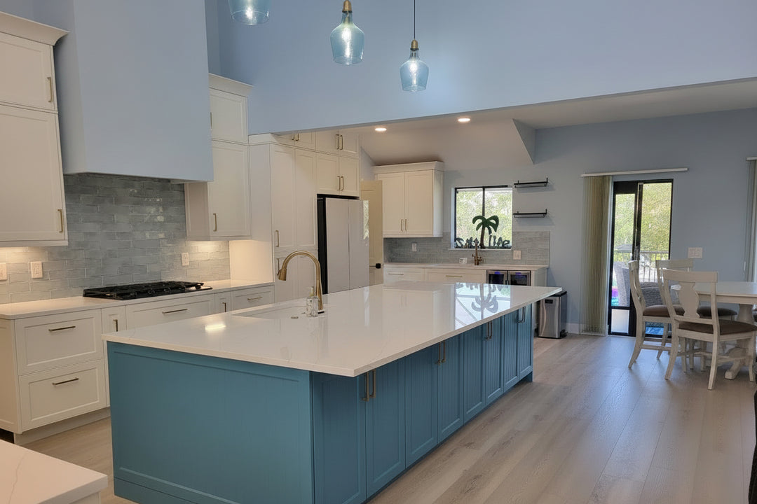 Modern kitchen with blue island and white countertops